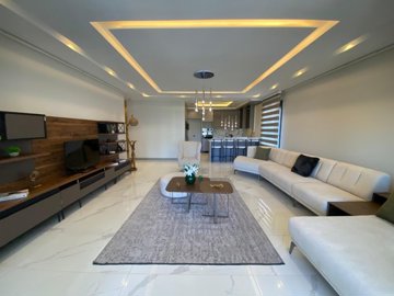 Blissful 2 & 3-Bed Apartments In Kusadasi For Sale With Luxury Facilities - Lounge and kitchen