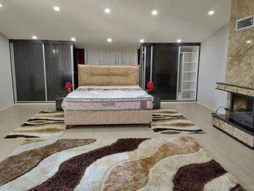 Lavish 4-Bedroom Villa For Sale In Belek - Double bedroom with fireplace