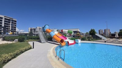 Brand-New Antalya Apartments In Altintas For Sale - Swimming pool with kids slides