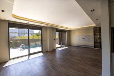 Indulgent Antalya Property For Sale - Lounge with pool and terrace access