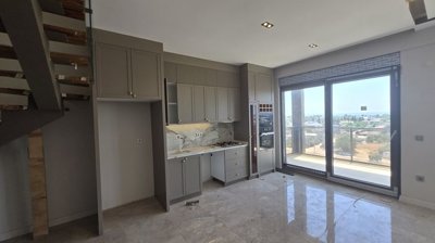 Antalya Residence Apartments In Altintas For Sale - Open-plan fitted kitchen