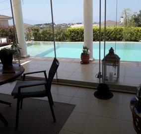 Sea & Nature View Property In Kusadasi For Sale - Living space with pool and terrace access