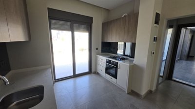 Garden Apartment For Sale In Antalya - Kitchen with garden access
