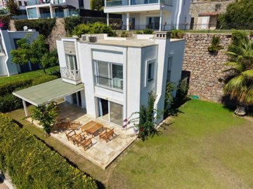 Sea View Villa For Sale In Kadikalesi, Bodrum - Arial view over the villa and garden