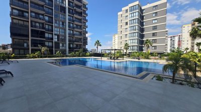 Divine 1-Bedroom Properties For Sale In Antalya - Communal swimming pool and terraces