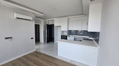 Divine 1-Bedroom Properties For Sale In Antalya - Modern kitchen and lounge