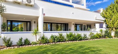 1732modernwhiteapartmentwithlandscapedgarden-