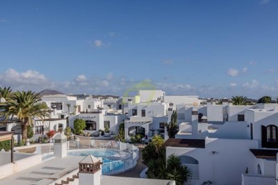 Peaceful living with roof views & pool access in gated complex