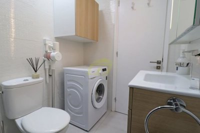 Immaculately presented first floor apartment with communal pool in great location