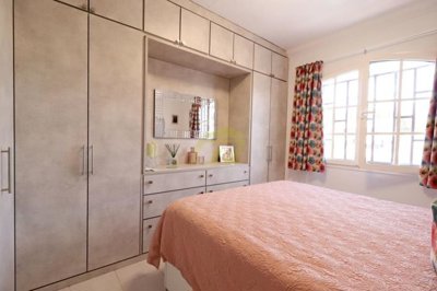 Immaculately presented first floor apartment with communal pool in great location