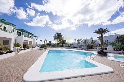 A beautifully presented first floor apartment with communal pool and storage included