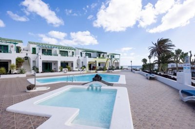 A beautifully presented first floor apartment with communal pool and storage included