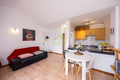 A beautifully presented first floor apartment with communal pool and storage included