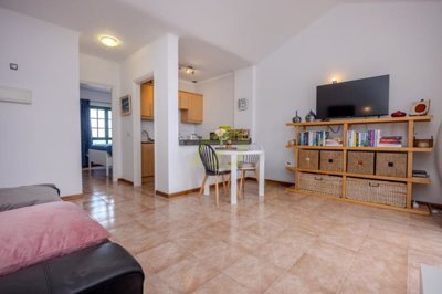 A beautifully presented first floor apartment with communal pool and storage included