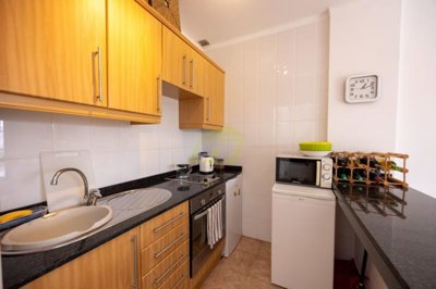 A beautifully presented first floor apartment with communal pool and storage included