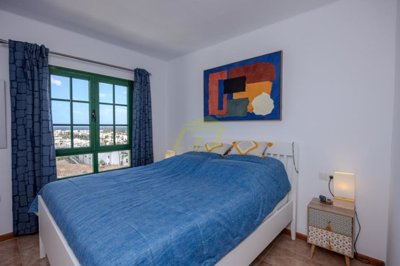 A beautifully presented first floor apartment with communal pool and storage included