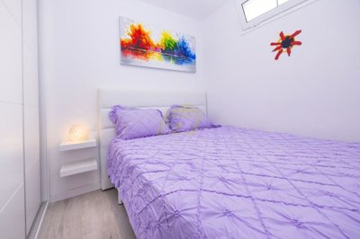 Immaculate apartment overlooking pool in private complex