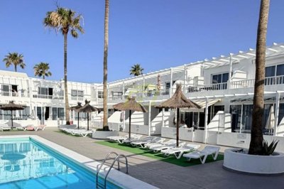 Immaculate apartment overlooking pool in private complex