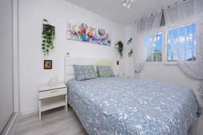 Immaculate apartment overlooking pool in private complex