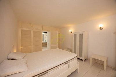 Spacious frontline property moments from the beach with a communal pool