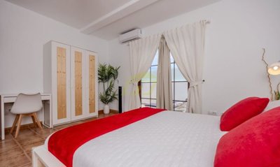 Top floor apartment with terrace, mountain views and off-road parking