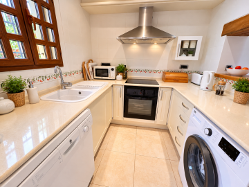 Bright-Mediterranean-Kitchen-with-Olive-Leaf-Tiles