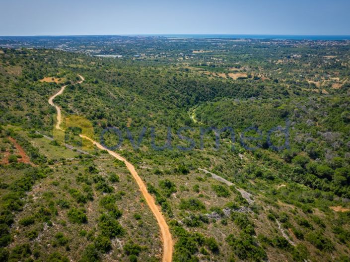 6,000 m² rural plot with panoramic views over the countryside and the sea in Boliqueime