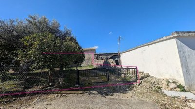 Three plots with stone-built houses in Giolou, Paphos