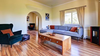 lounge with arch to bedroom