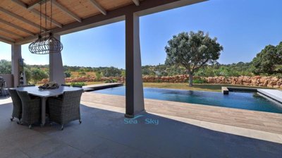 large covered terrace overlooking the pool