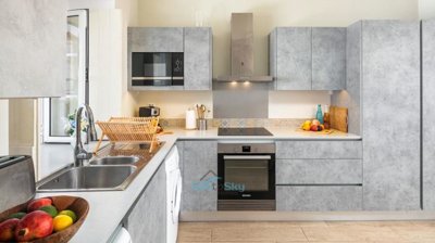 fitted kitchen with built in microwave, oven, hob+extractor