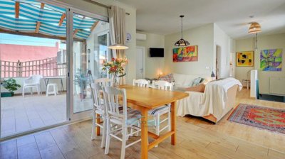 open to living area and patio doors to terrace