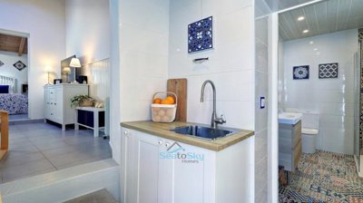 kitchen with door to bathroom