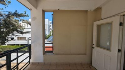Three storey semi-detached mixed use building with shop and attic in Strovolos, Nicosia