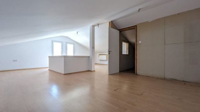 Three storey semi-detached mixed use building with shop and attic in Strovolos, Nicosia