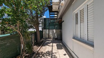 Three storey semi-detached mixed use building with shop and attic in Strovolos, Nicosia