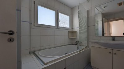 Three storey semi-detached mixed use building with shop and attic in Strovolos, Nicosia