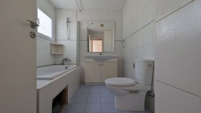 Three storey semi-detached mixed use building with shop and attic in Strovolos, Nicosia