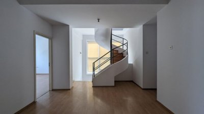 Three storey semi-detached mixed use building with shop and attic in Strovolos, Nicosia