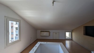 Three storey semi-detached mixed use building with shop and attic in Strovolos, Nicosia