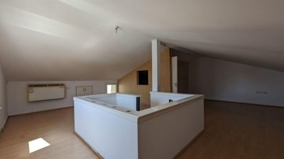 Three storey semi-detached mixed use building with shop and attic in Strovolos, Nicosia