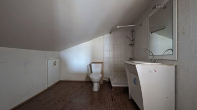 Three storey semi-detached mixed use building with shop and attic in Strovolos, Nicosia