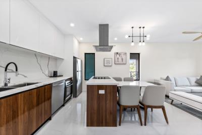 Arza-2BR-Den-Walkout-Patio-dining-area-Cayman-Islands-Real-Estate