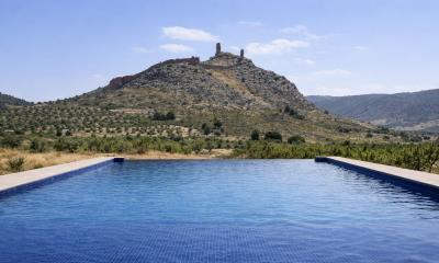 Infinity-pool-with-ancient-fortress-backdrop