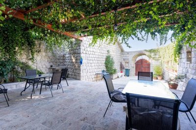 old-stone-house-with-beautiful-frontyard-for-