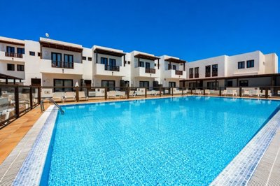 Stylish Duplex with Pool Views and Private Parking in Exclusive Puerto Calero
