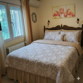 cosy20bedroom20with20ornate20wooden20headboar