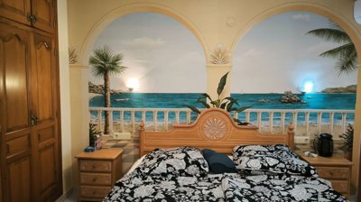 guest-bedroom-featuring-a-tropical-beach-mura