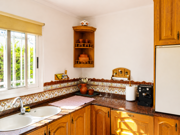 a-rustic-fitted-wooden-kitchen-with-a-granite