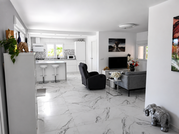 open-concept-living-room-and-white-kitchen-wi